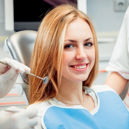 Young woman smiling in dental chair