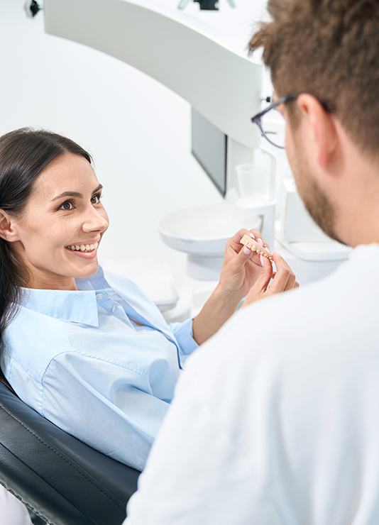Patient in Oklahoma City smiling after dental bridge placement 