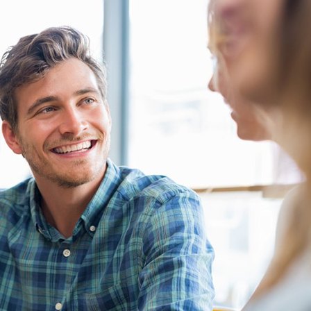 Patient in Oklahoma City smiling confidently with a new dental bridge