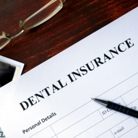 Dental insurance paperwork on desk