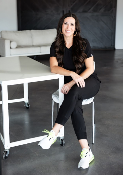 Dental team member sitting at white table