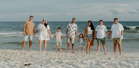 Doctor Holman with his family on the beach