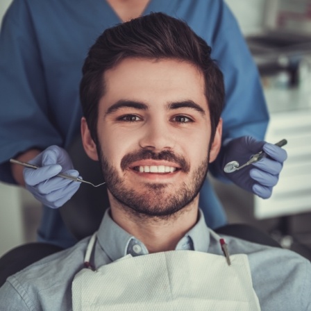 Young man smiling in dental chair