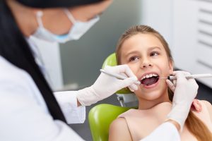 young girl at dentist