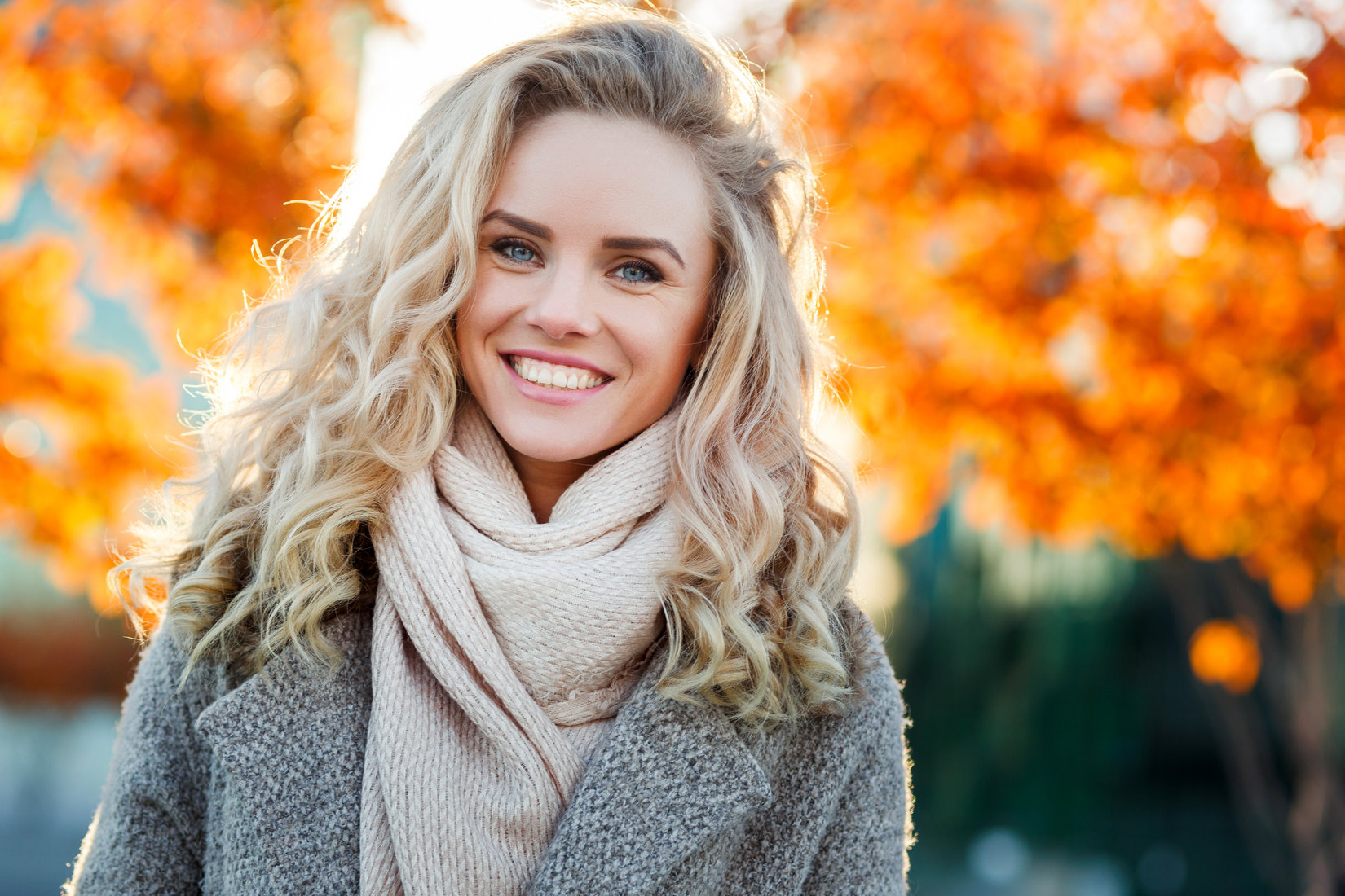 Beautiful Smiling Blond Woman With Curly Hair And Blue Eyes Ok