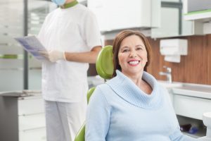 Woman in dental chair at dentist in OKC.