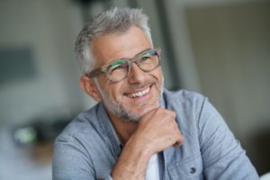 older man smiling after getting affordable teeth whitening in Oklahoma City 