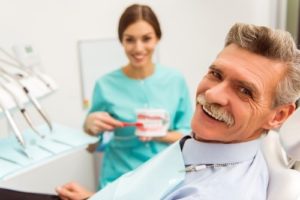 Man at dental checkup with dentures