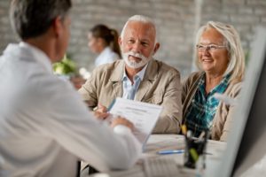 senior man and woman asking their dentist if dental implants are safe for diabetics