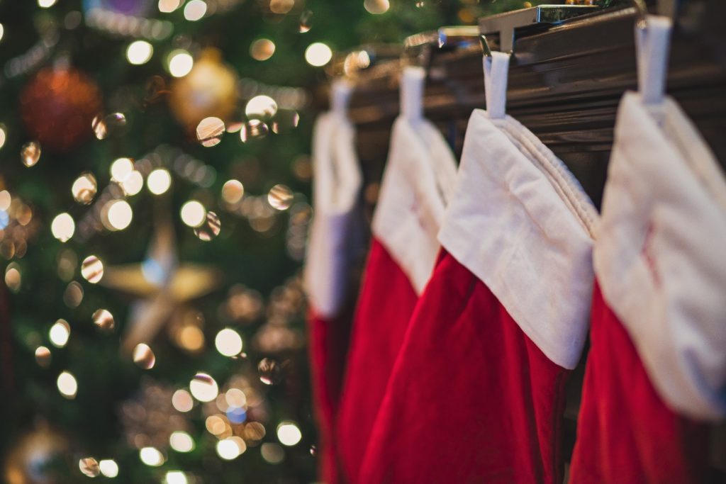 Red and white stockings hung on the mantle